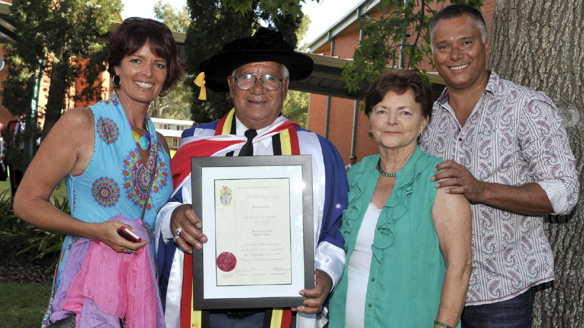 Wiradjuri elder Stan Grant is congratulated on his honourary doctorate by daughter-in-law Tracey Holmes (left), wife Betty and son Stan. Picture: Les Smith