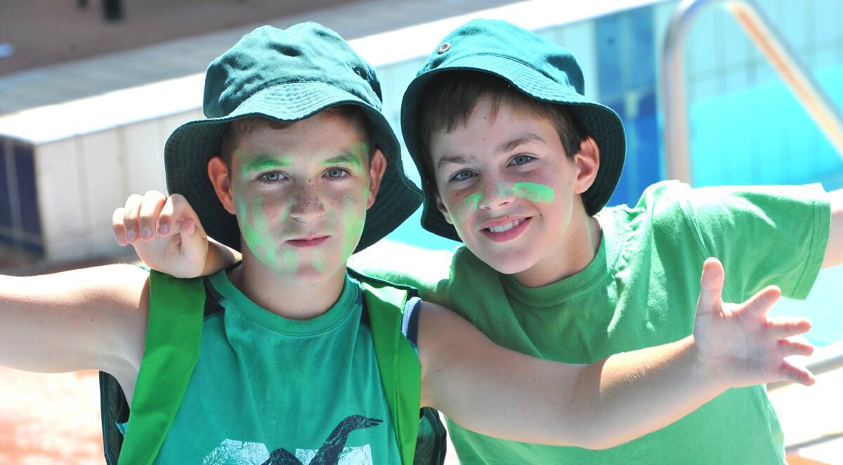 Showing their support for Hume house at the Turvey Park Public School swimming carnival are (from left) Mitch McCauley and Tim Jenkins, both 11.
