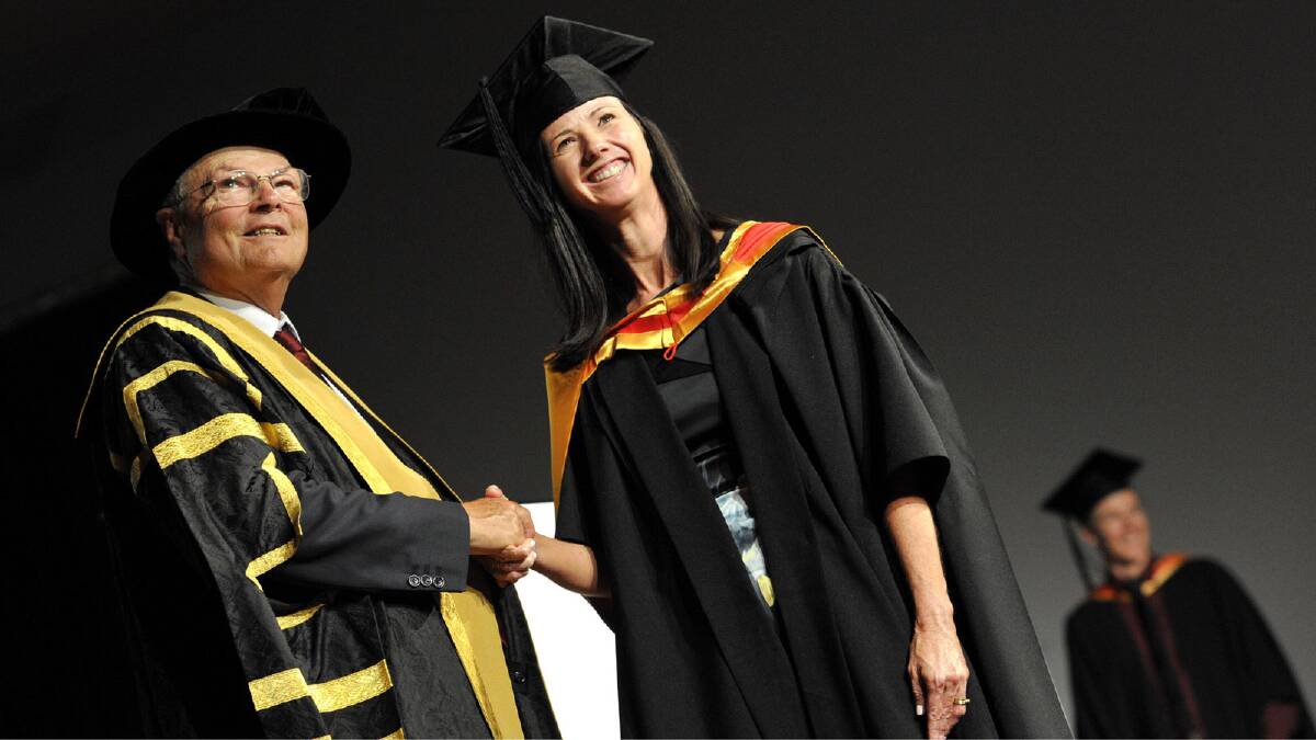 Vanessa Pincham receives a masters of medical ultrasound from chancellor Lawrie Willett. Picture: Les Smith