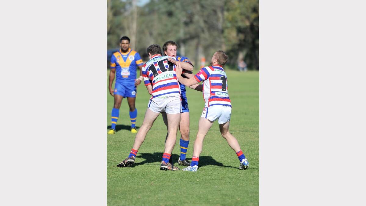 Young's Kyle Richens and Riley Scelly put a stop to Junee's Rhys Clemson. Picture: Alastair Brook