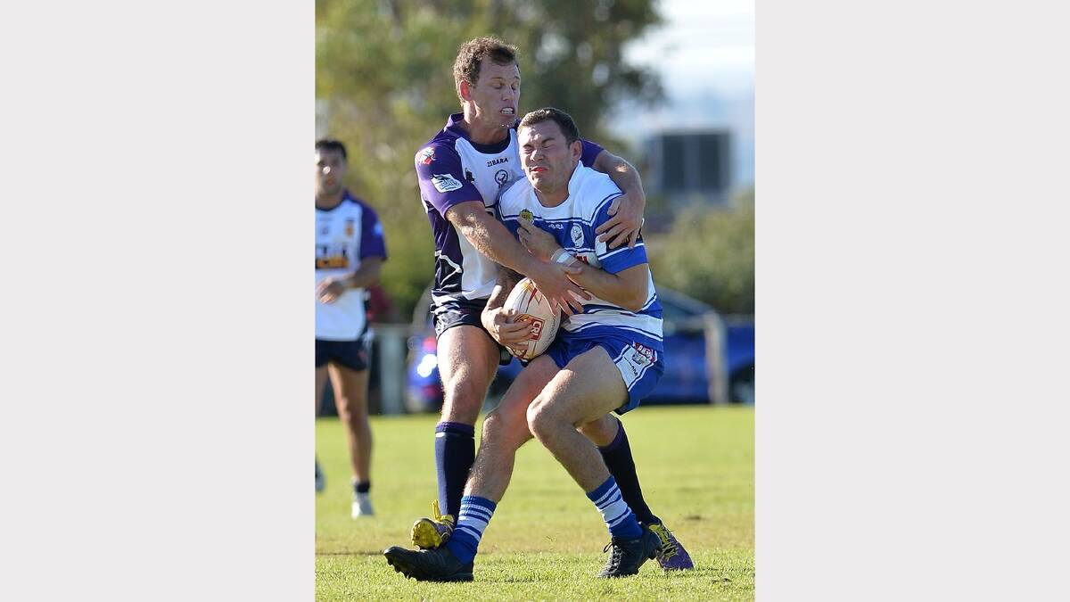 Cootamundra's Chris Maher is tabkled by South City's Scott Bowden. Picture: Michael Frogley