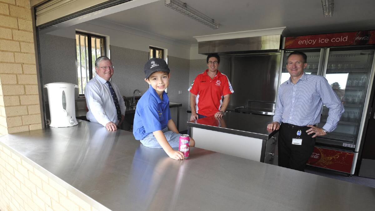 Future CSU bushpig Henry Angel, 6, with Professor Ken Dillon, CSU football president Jeff Angel and facilities manager Stephen Butt inspect the upgrades to the Peter Hastie canteen area. Picture: Les Smith