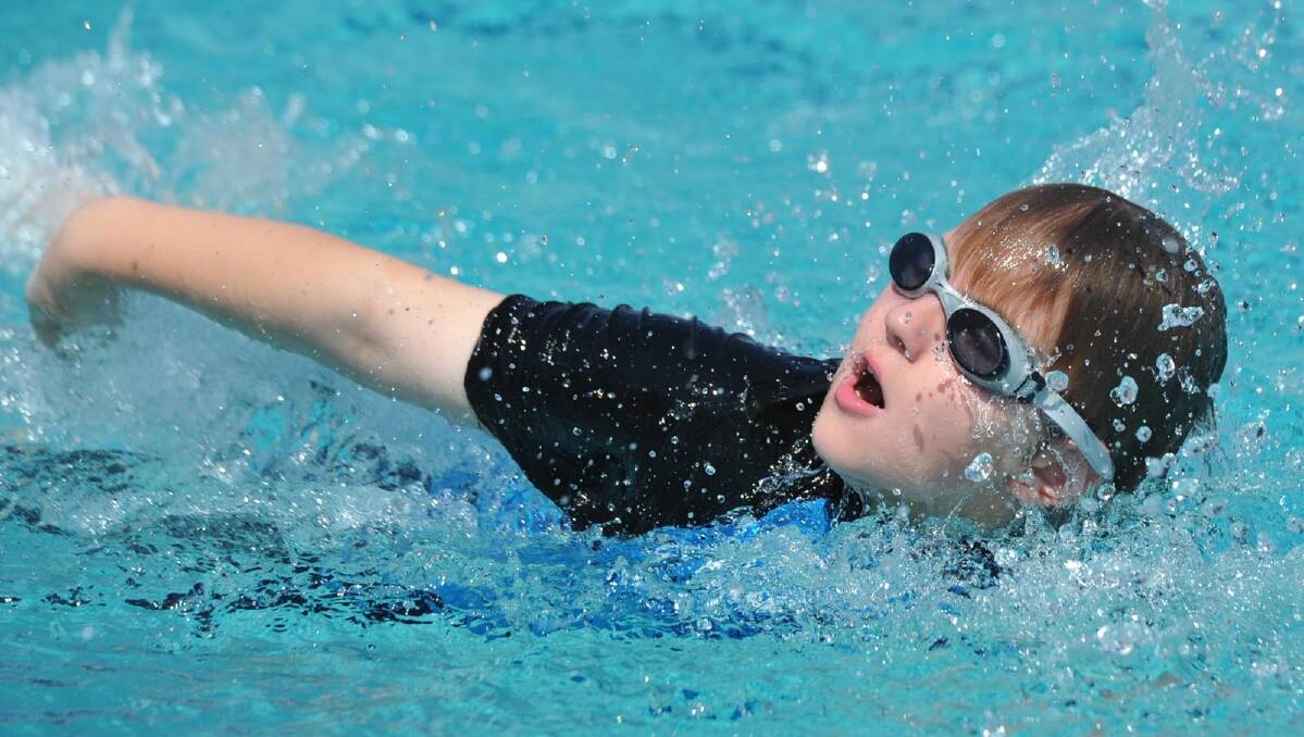 James Thomson, 11, in a 25m freestyle race. Picture: Les Smith