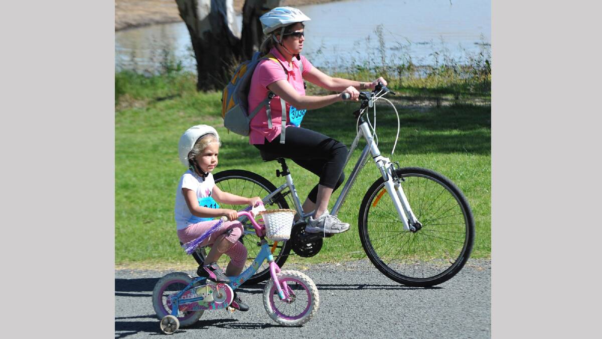 Lake to Lagoon 2013 - Zara Kotzur, 5, with her mum Belinda, Wagga finishing their bike ride. Picture: Les Smith