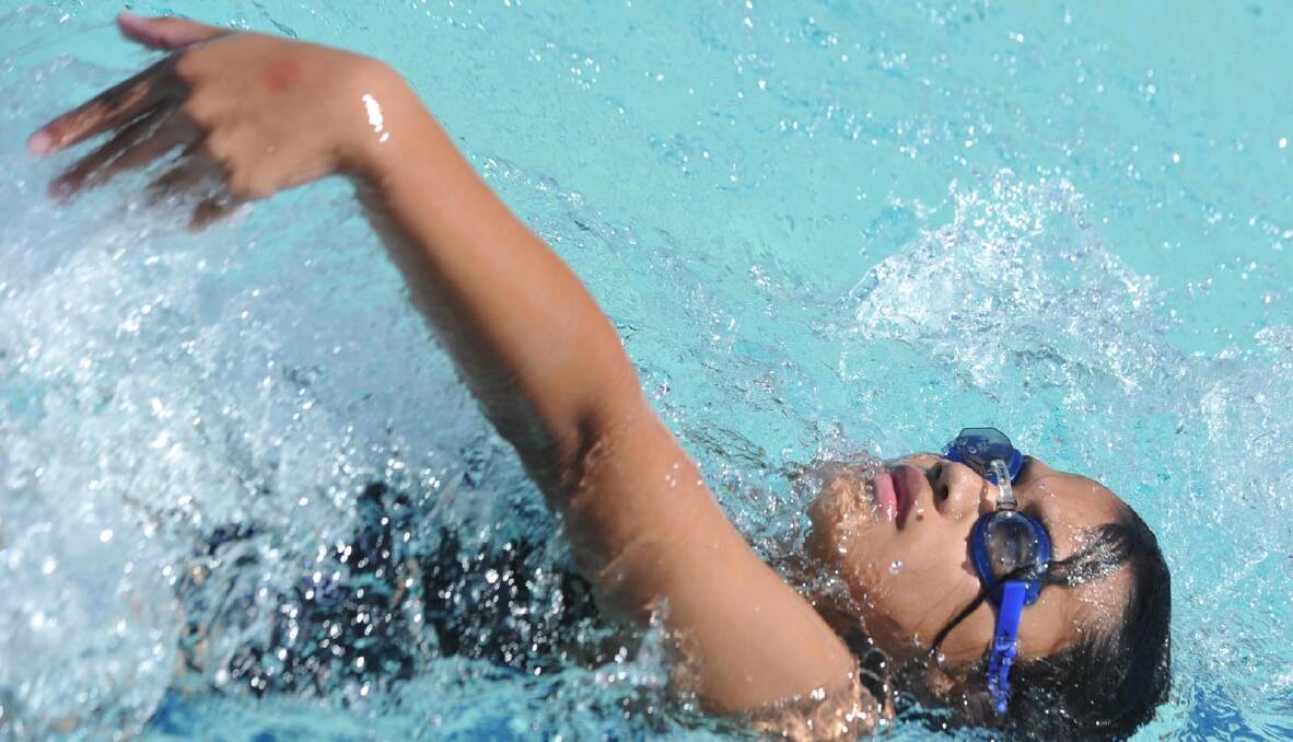 Melanie Fasala, 11, of Sturt House in a 50m backstroke race. Picture: Les Smith