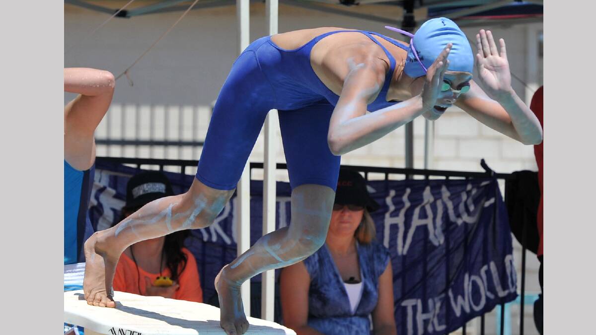 Milli Gentles, 12, dives in at the Kildare Catholic College swimming carnival. Picture: Michael Frogley 