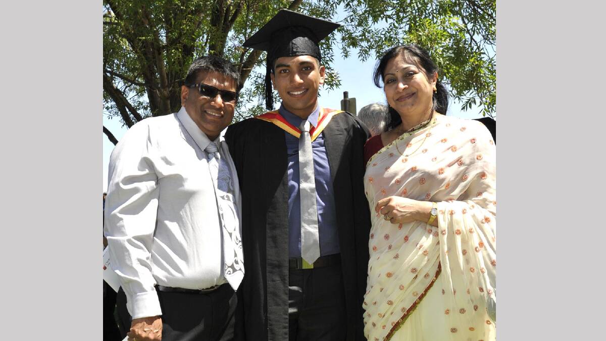Proud parents Raj and Subhashni Subrail from Canberra celebrate son Nikhil's pharmacy degree. Picture: Les Smith