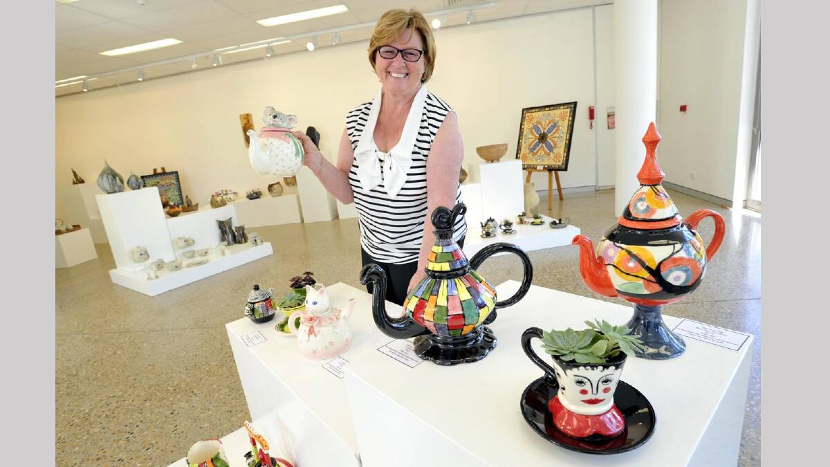 Wagga Potters Club member Maggie Marriott with pieces on display at an exhibition at the E3 art space. Picture: Les Smith