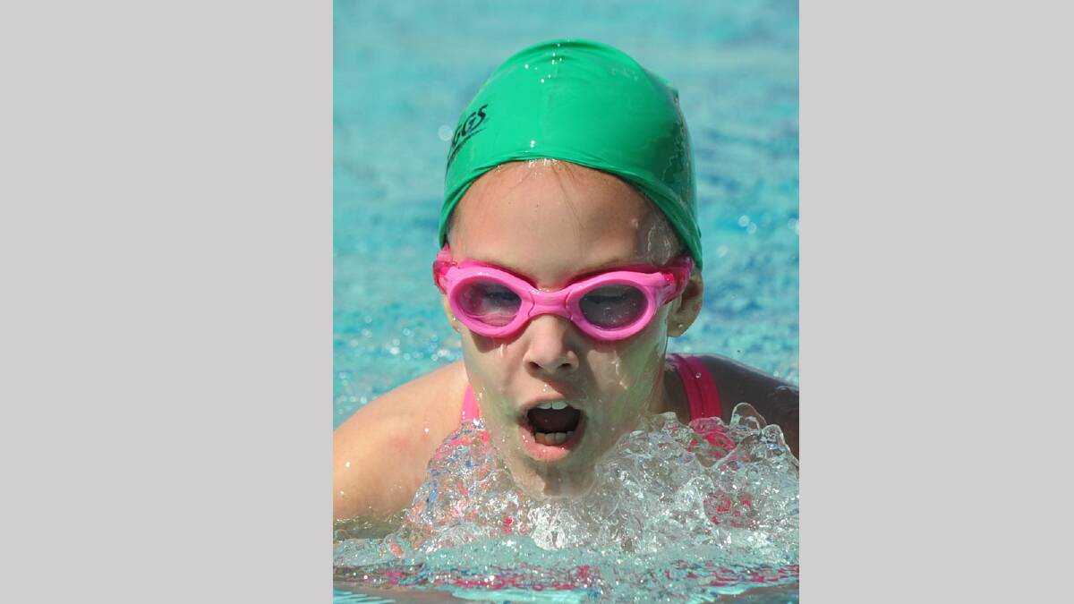 Maddie Hay, 11, of Harris House wins her 50m breaststroke race. Picture: Les Smith