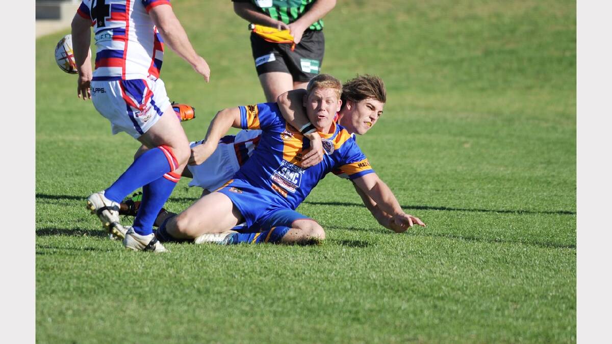 Junee Young's Kade Foreman brings down Junee's Josh Whitty. Picture: Alastair Brook
