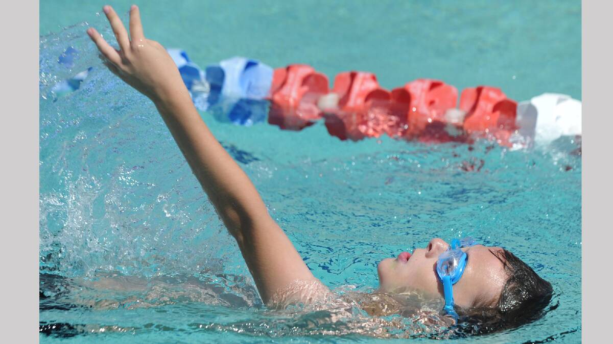 Lachlan Smith, 9, in his 50m backstroke race. Picture: Les Smith 
