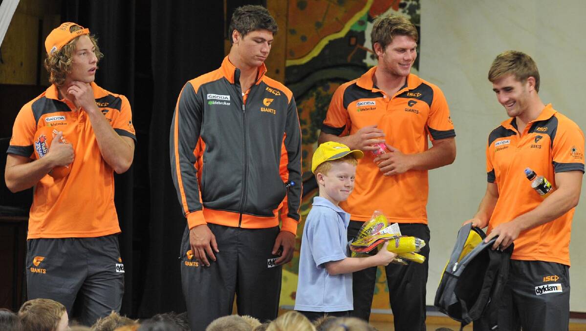 Tye Dasey, 9, is presented with the Auskick backpack. Picture: Michael Frogley