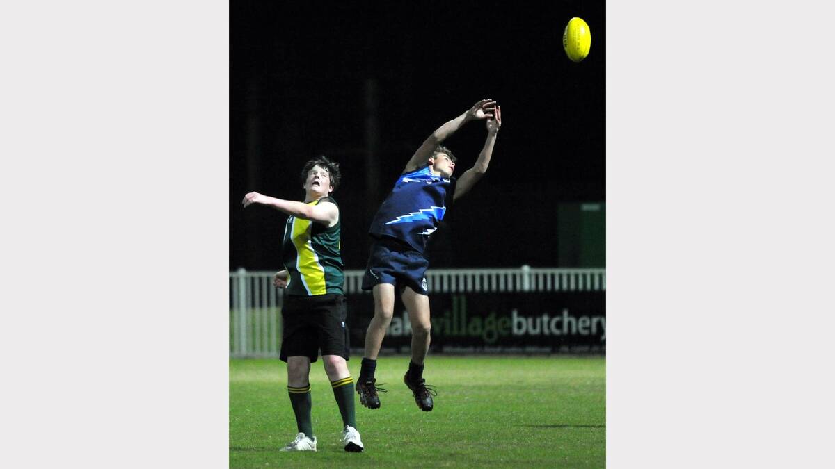 Wagga High School's Jed Winter tries to take a mark under pressure from Mount Austin High School's Nick Flanigan. Picture: Les Smith