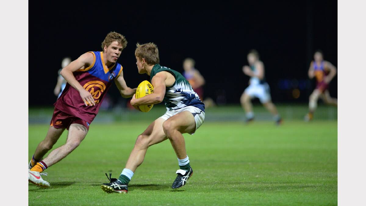 TRAC's Charlie Bance (right) does his best to outstep Jake Crouch. Picture: Michael Frogley