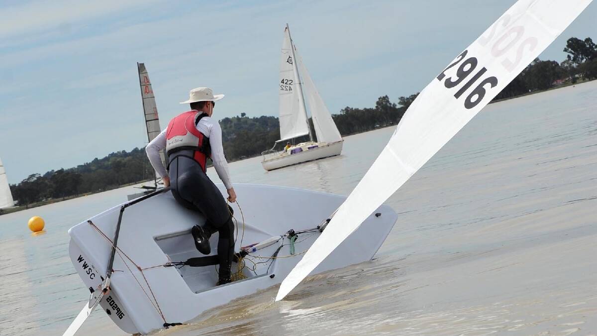 Greg Williams gets his Laser keeled over during the Wagga Sailing Club regatta on Lake Albert. Picture: Michael Frogley