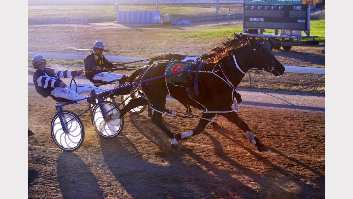 Mighty Boy Lombo (outside) driven by Jack Painting edges out River Light driven by Blake Jones in race six. Picture: Alastair Brook