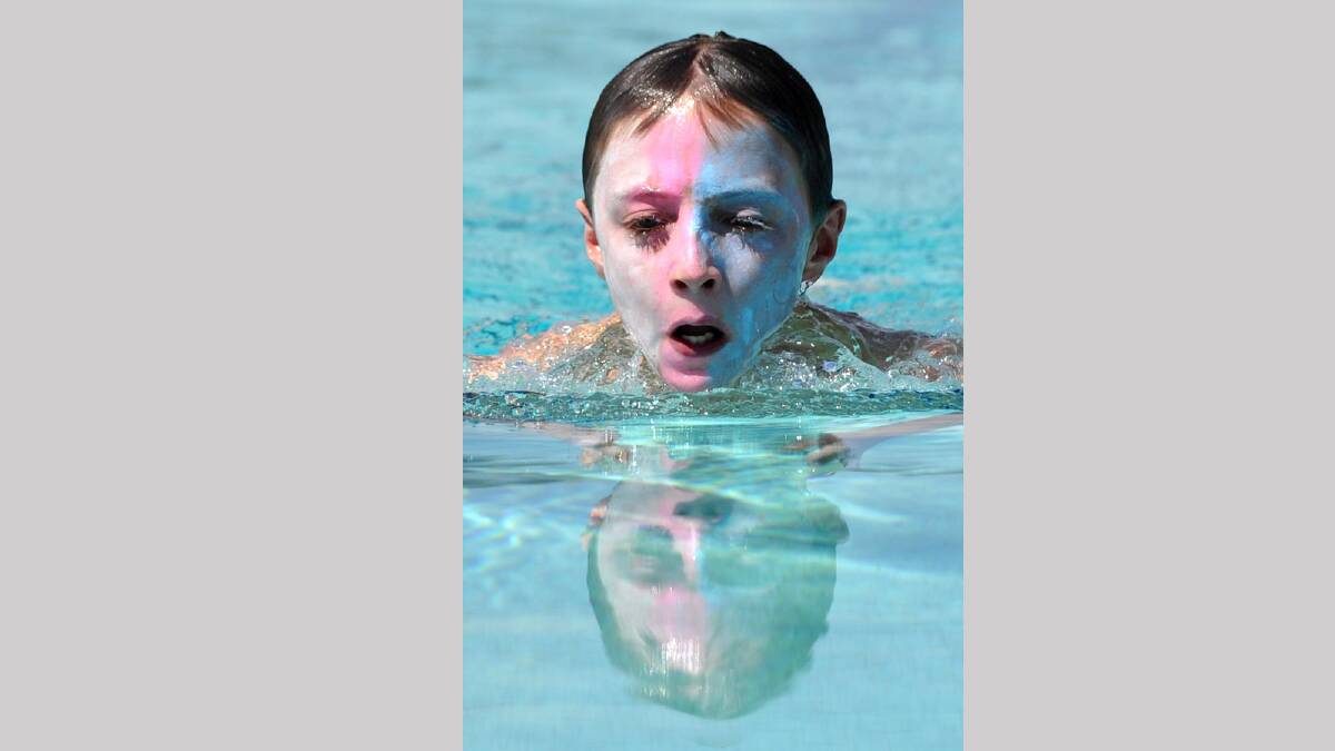 Lachlan Armstrong, 12, of Fraser House winning his 50m breastroke race. Picture: Les Smith