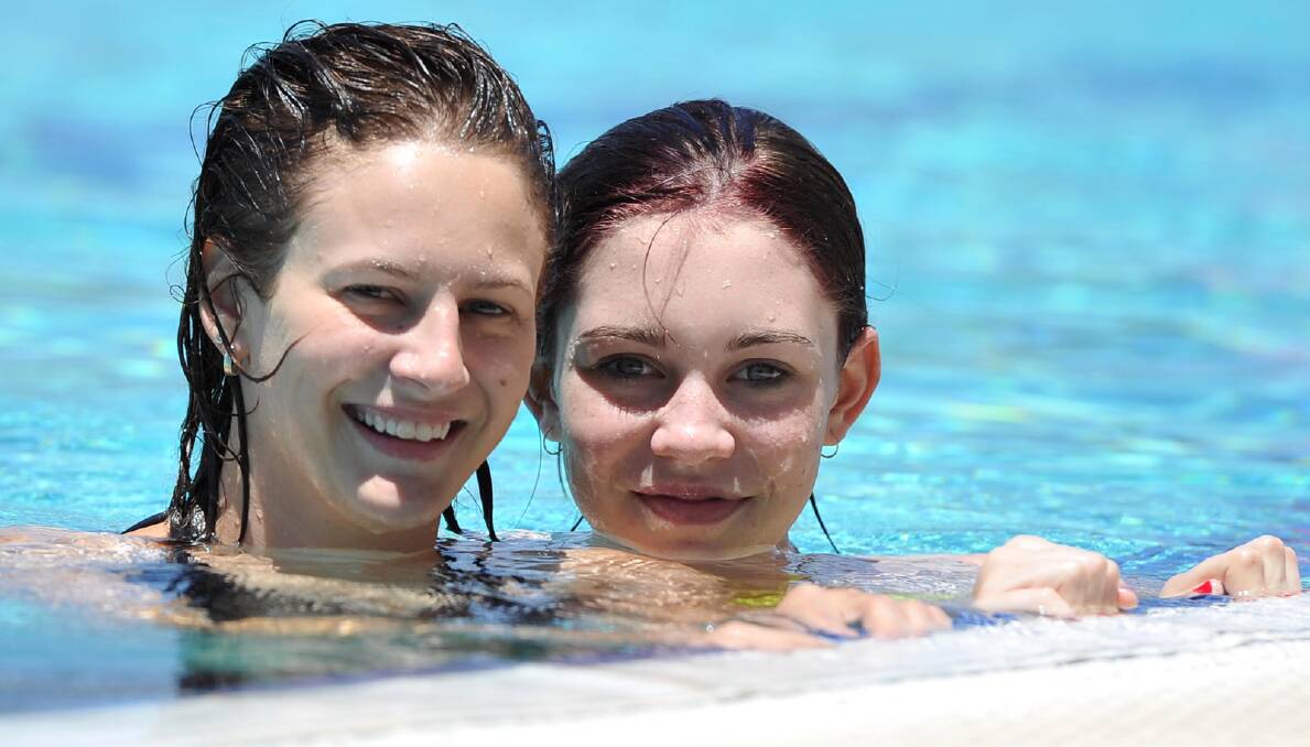 SCORCHER: Chelsea Oakman and Lakkin Jarvis try to beat the heat by cooling off at Oasis. Picture: Michael Frogley 