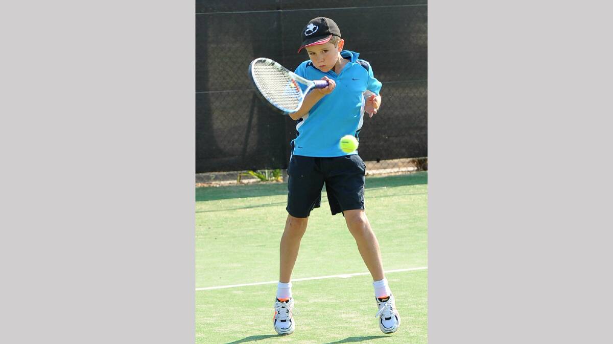 Henry Kennedy, 9, connects with his forehand in junior tennis. Picture: Michael Frogley
