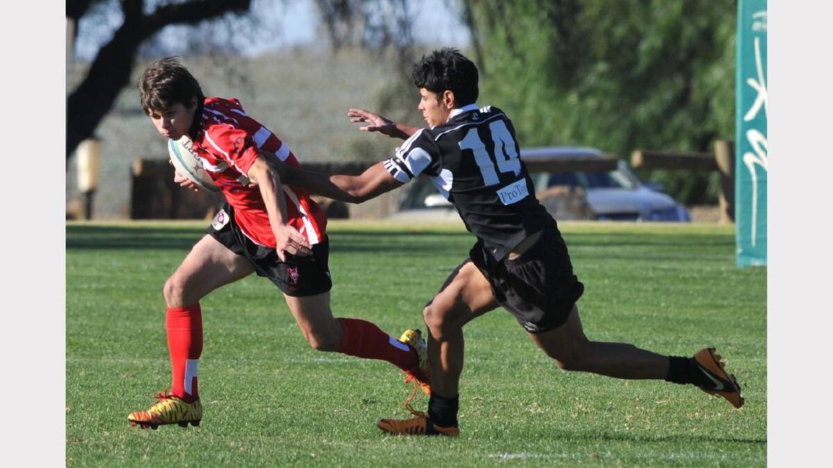  CSU's Brett Wendt getting past Griffith's Sione Siale. Picture: Les Smith