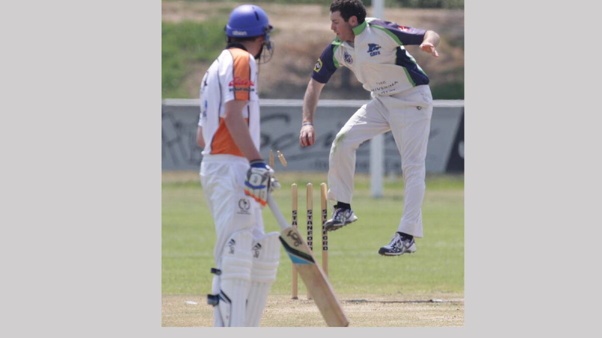Wagga's RSL Aaron Maxwell jumps high to take a wicket as Sam Perry looks on. Picture: Les Smith