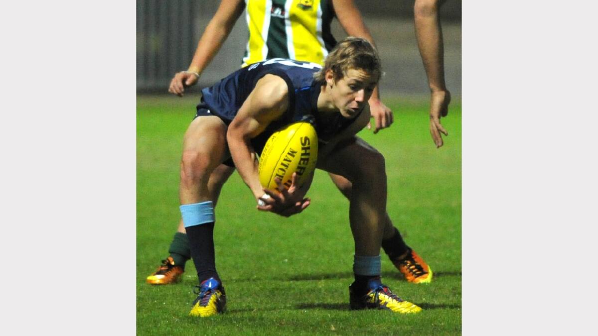 Wagga High School's Jono Lally gets down low to collect the ball. Picture: Les Smith