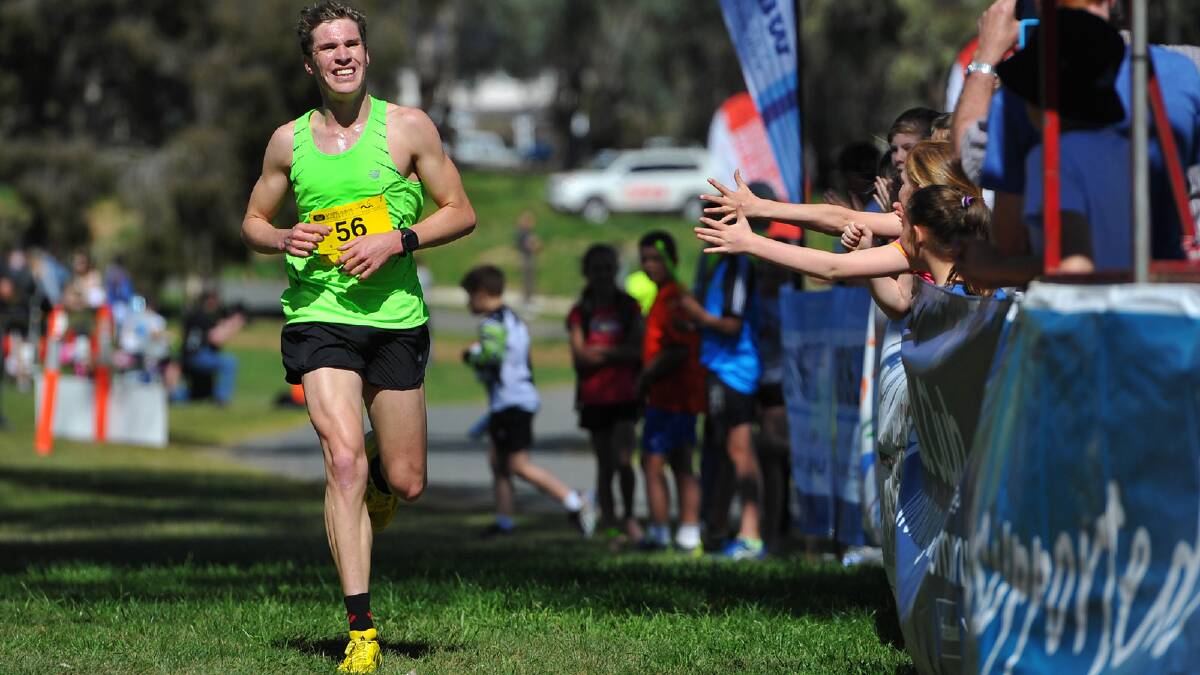 Lake to Lagoon 2013 - second placed finisher Caleb Noble crosses the line. Picture: Addison Hamilton