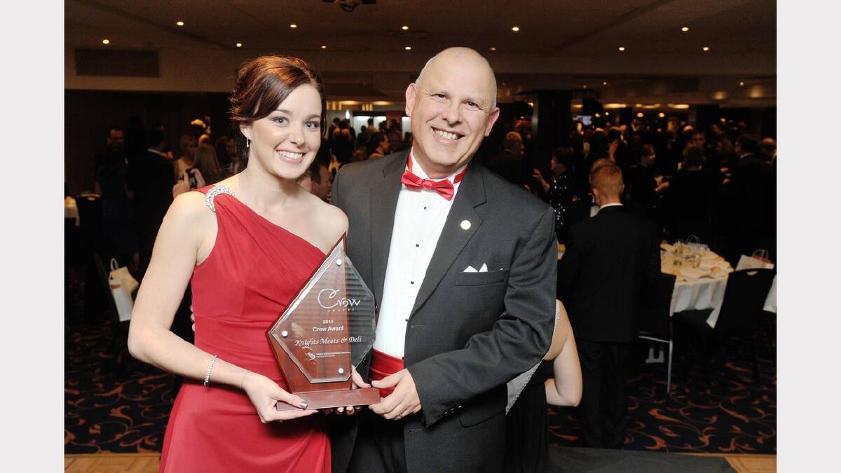 Crow Awards manager Casey Wilson holding the Crow Award with Wagga Business Chamber Manager Larry Buete. Picture: Alastair Brook