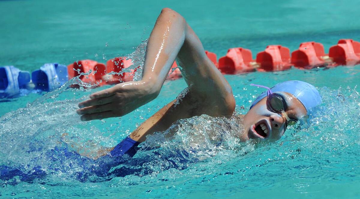 Milli Gentles, 12, in a freestyle race at the Kildare Catholic College swimming carnival. Picture: Michael Frogley 