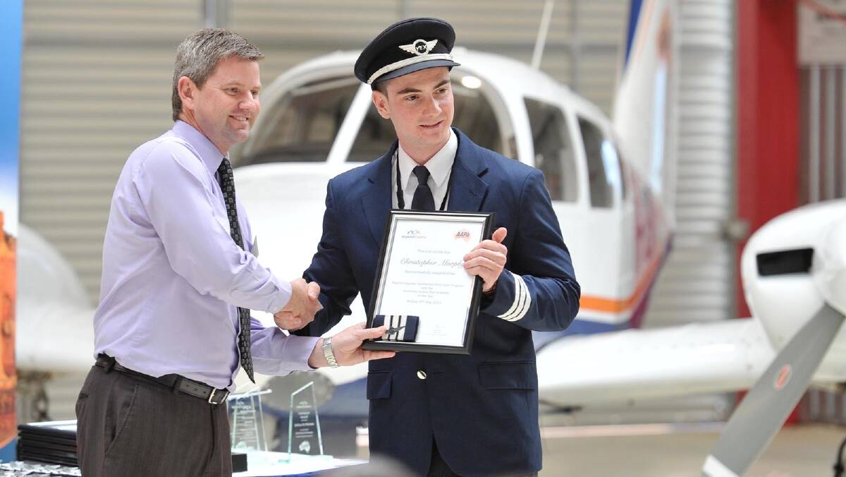 AAPA General Manager Geoffrey Cook hands certificate to Christopher Murphy. Picture: Alastair Brook
