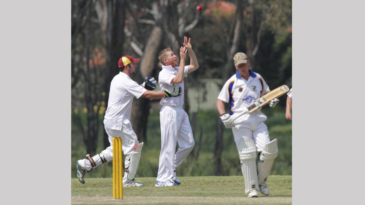 Lake Albert's Sam Quinton takes a catch to dismiss Ben Webster and is congratulated by wicketkeeper Jason Halls. Picture: Les Smith 