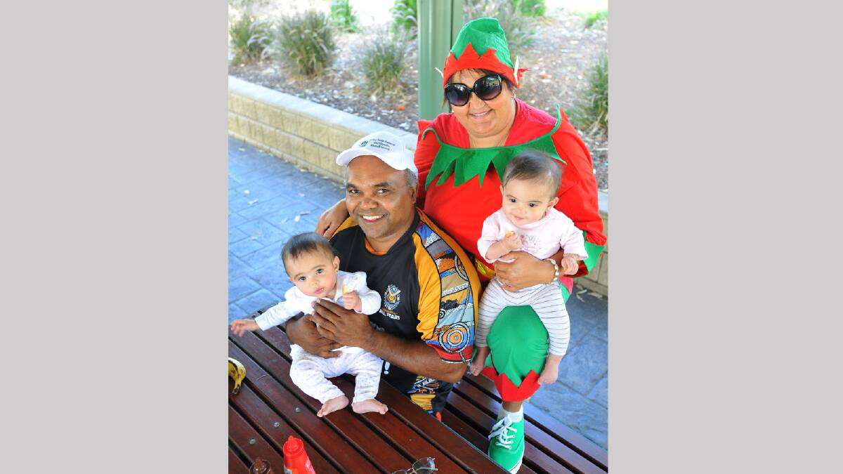 David and Georgina O'Neill with their eight-month-old grandchildren, twins Alexys and Airlee O'Neill enjoying the Mawang Gaway Aboriginal Consultative Group Christmas Party. Picture: Addison Hamilton 