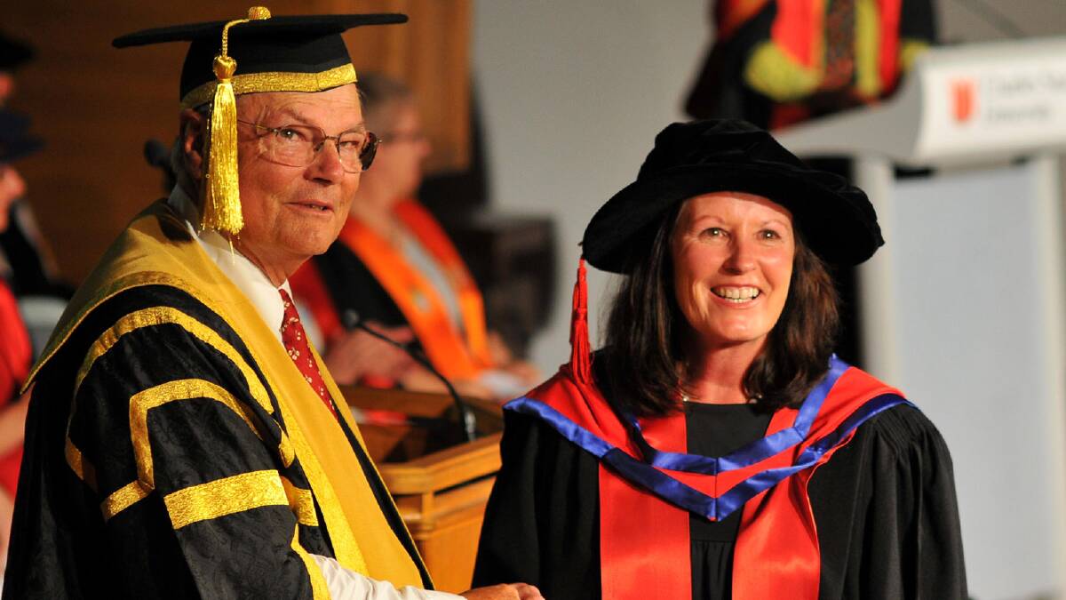 Chancellor Lawrence Willett congratulates Amanda Davies for her achievement of Doctor of Philosophy. Picture: Michael Frogley 