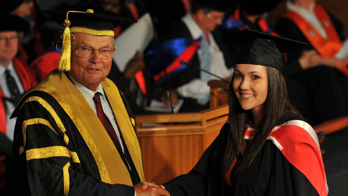 CSU chancellor Lawrence Willett congratulates Kelli Anne McClintock on her Bachelor of Arts (Animation and Visual Effects). Picture: Addison Hamilton 