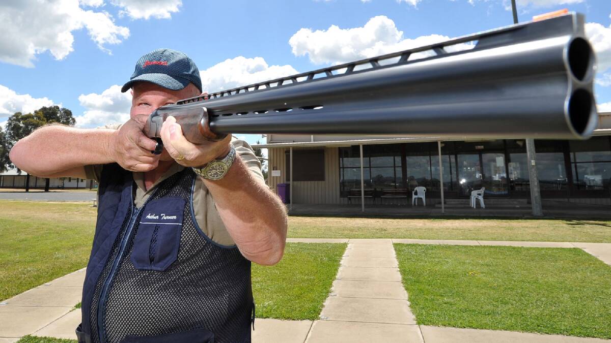 Wagga marksman Arthur Turner takes aim with his shotgun at the National Shooting Ground in Wagga yesterday. Picture: Michael Frogley