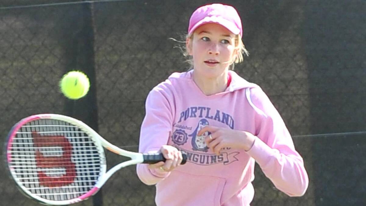 Whitney Driscoll, 14, plays a forehand in junior tennis. Picture: Michael Frogley