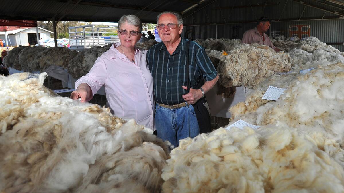 Robyn and Gerry Louttit of Culcairn looking at some wool at the Culcairn Centenary Show. Picture: Les Smith