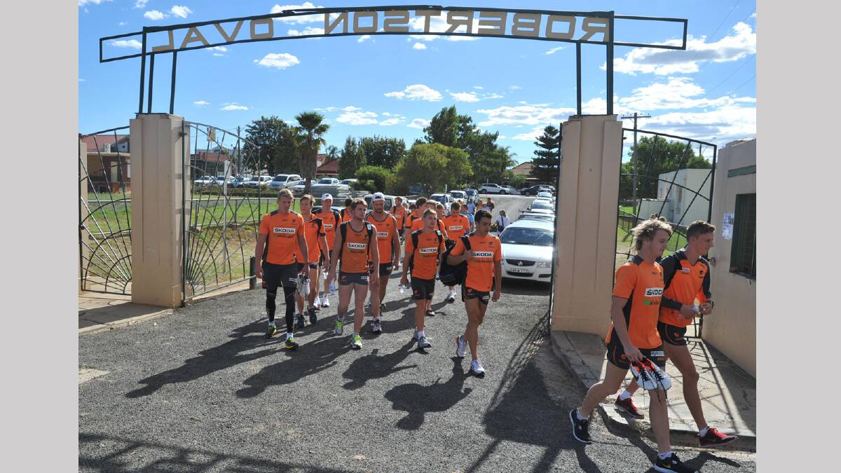 GWS players entering under the Robertson Oval gates. Picture: Les Smith
