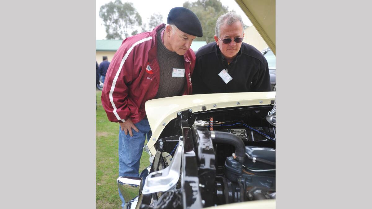 Wagga Veteran Vintage Motor Car rally -  Paul Westblade talks to owner Craig Kelly about his 1960 FB Holden Panelvan. Picture: Alastair Brook
