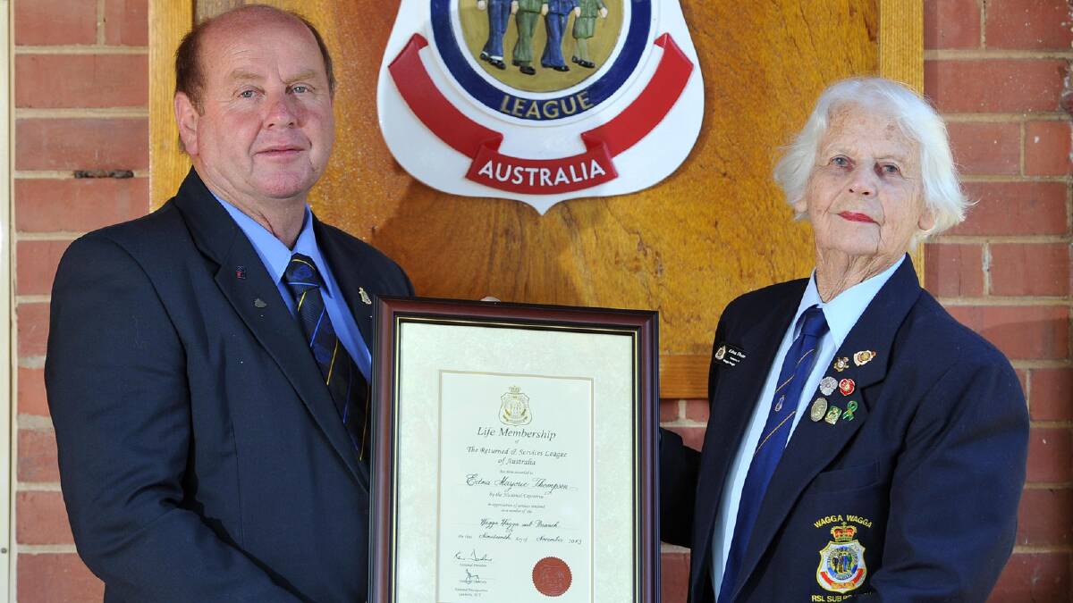 Wagga RSL Sub-Branch treasurer Brian Watts presents life membership to Edna Thompson, the first woman for the Wagga sub-branch. Picture: Michael Frogley 