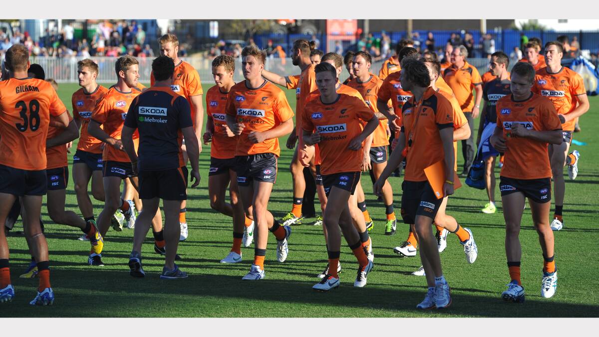 GWS v Brisbane at Robertson Oval - GWS during their warmup on Robertson Oval. Picture: Addison Hamilton
