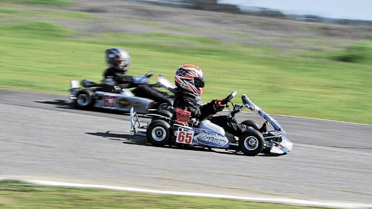 SMART MOVE: Noah Sands looks to pass on the inside of Jye Hefren during Sunday’s racing off Tasman Road.