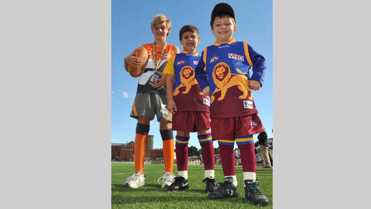 Lochie Rosler, 9, from Wagga, Charlie Gett, 6, and his brother Toby, 5, from Albury will be the mascots for the NAB Cup game tomorrow. Picture: Les Smith