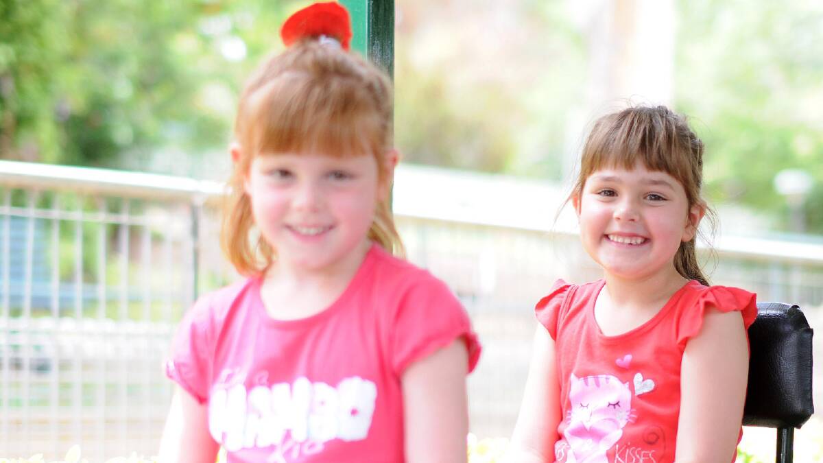 Lucy and Sarah Ayton enjoying at ride on the miniature trains at Willans Hill. Picture: Jacinta Coyne 