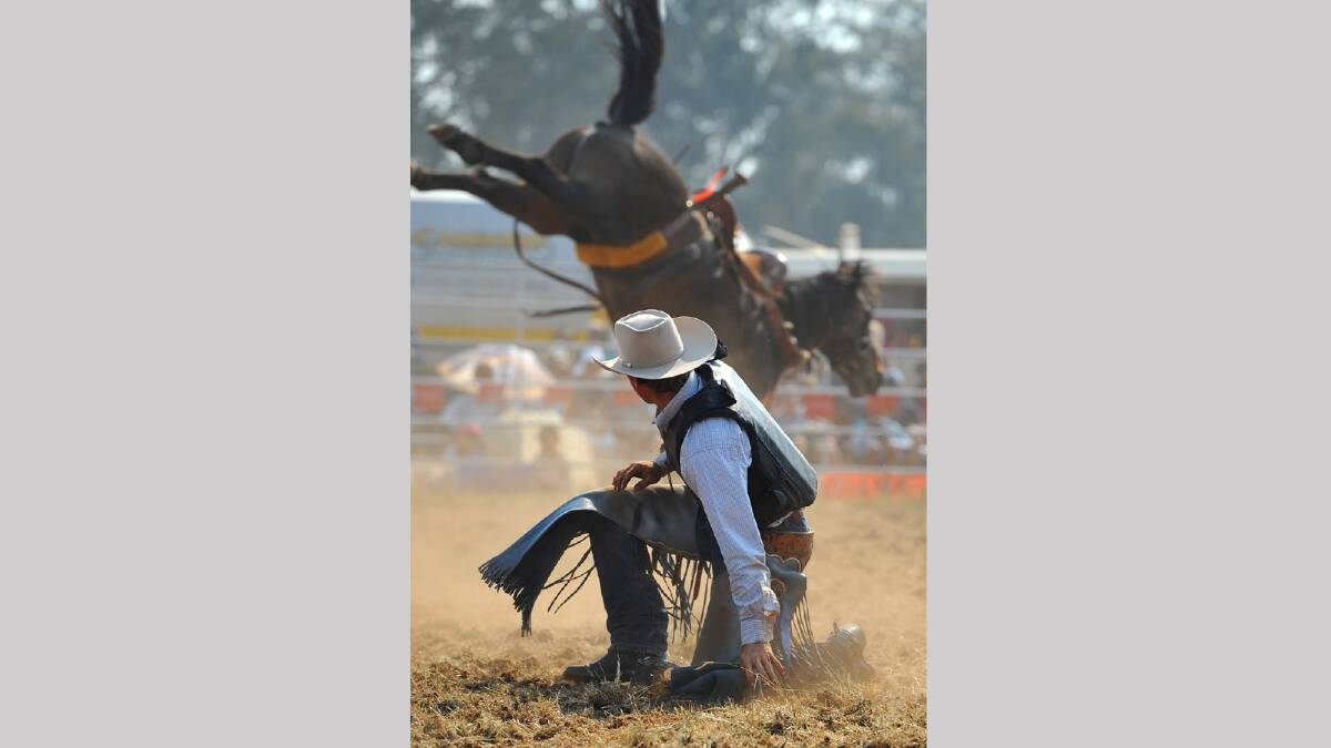 John Mitchell in the second division, watches his horse buck after he falls off in the bronco riding competition. Picture: Addison Hamilton