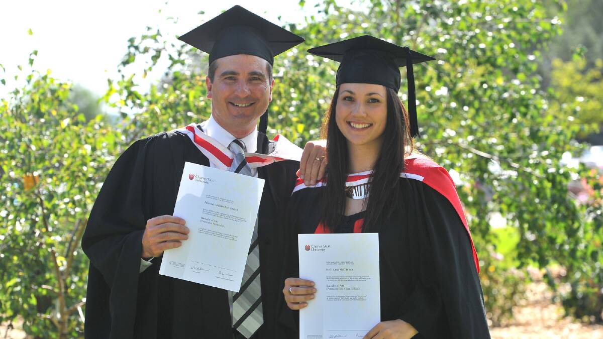 Father and daughter Michael and Kelli Anne McClintock both graduated on the same day, in a Bachelor of Arts (TV Production) and Bachelor of Arts (Animation and Visual Effects) respectively. Picture: Addison Hamilton 