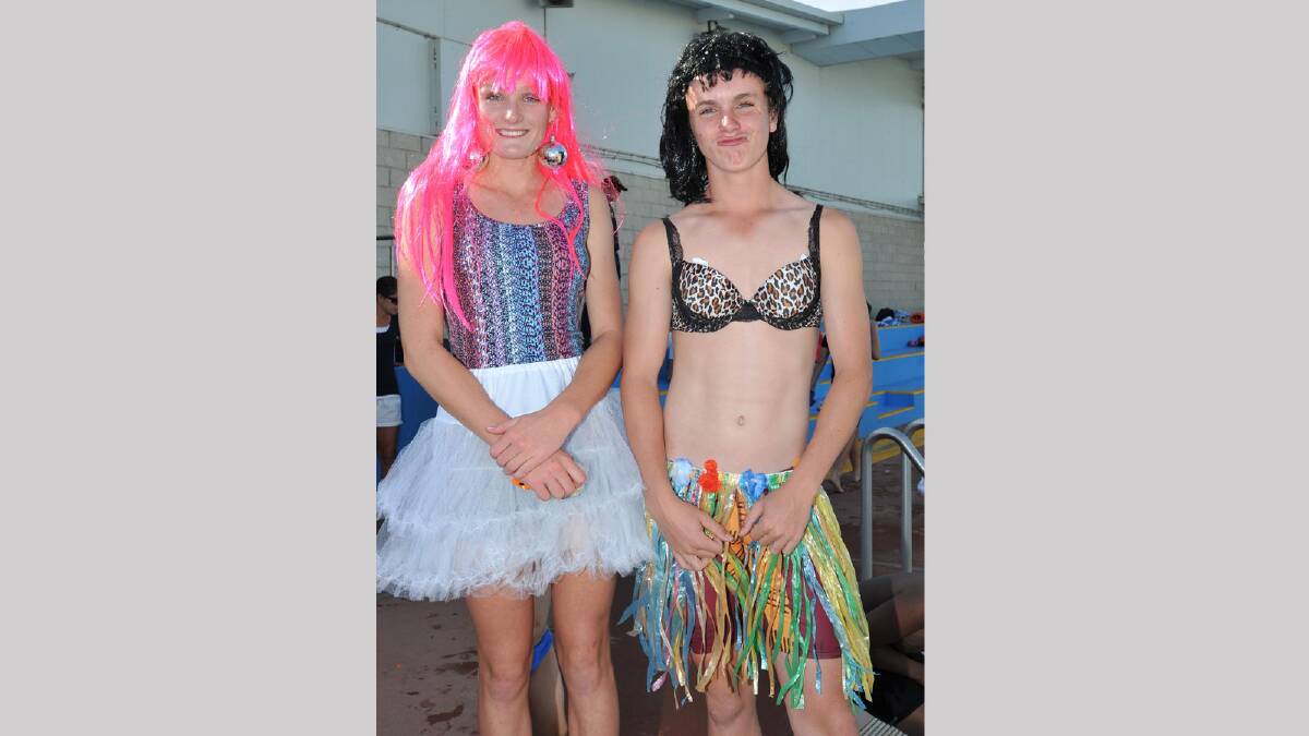 Lara Duffy, 14, helps Steven Senior, 14, get in touch with his feminine side at the Wagga Swimming Club Christmas Party at the Oasis. Picture: Michael Frogley