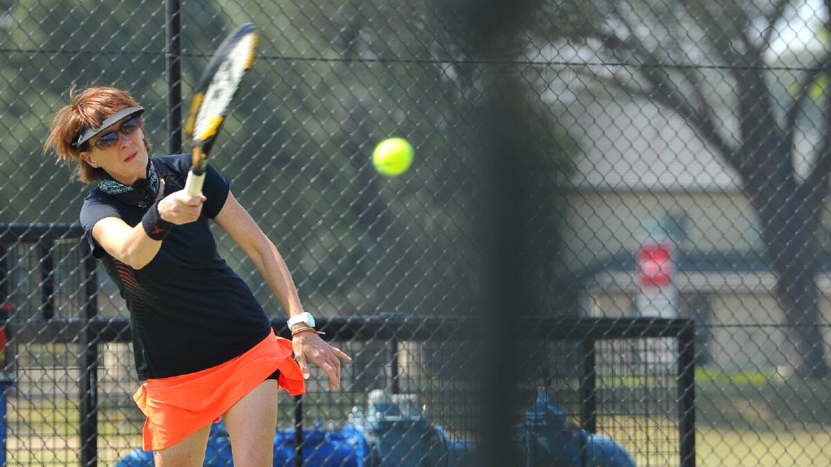 Helen Shea gets pushed while hitting a forehand at the Riverina Pennant Tennis at Bolton Park. Picture: Addison Hamilton