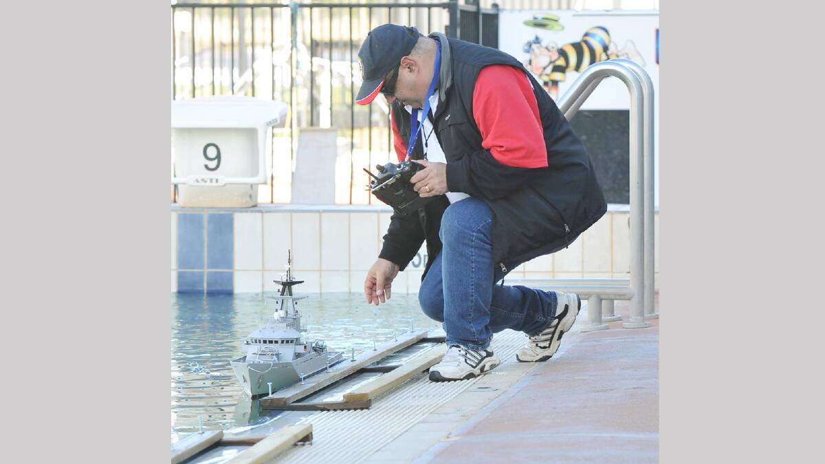 Vince Capurso (from Adelaide) launches his boat during the task force 72 scale model ship association at Oasis Swimming Centre. Picture: Alastair Brook