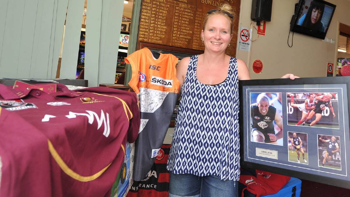 Fund-raiser organiser and manager of the Ganmain Bowling Club Kelly Underwood displays some of the auction items. Picture: Michael Frogley 